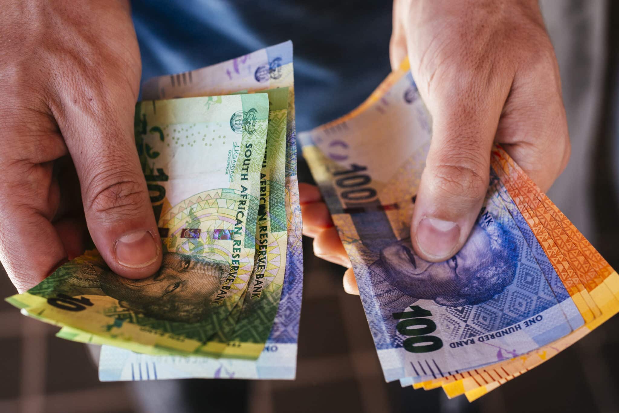 A collection of mixed denomination South African rand banknotes